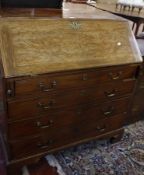 A George III mahogany bureau with a fitted interior and four long graduated drawers 103cm wide