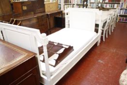 A painted white bed frame and mattress 201cm length, 111cm wide