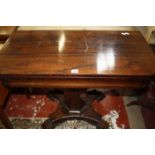 A William IV rosewood tea table on facetted column, quadraform pedestal and scrolled feet 92cm wide