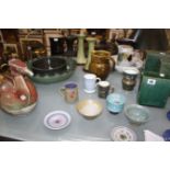 A quantity of studio pottery, to include Rye Pottery, St Andrews pottery, a model of a grebe,