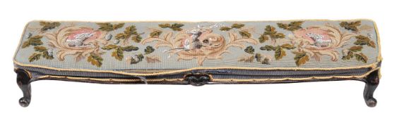 A fireside stool, 19th century, the tapestry top with oak leaf motifs and three cartouches each with