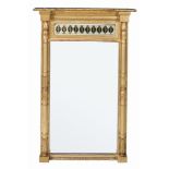 A Regency giltwood pier mirror , circa 1815, the moulded cornice and beading above a reverse painted
