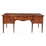A George III mahogany serpentine fronted sideboard  , circa 1790, the top above a central drawer
