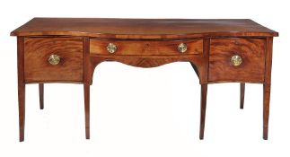 A George III mahogany serpentine fronted sideboard  , circa 1790, the top above a central drawer