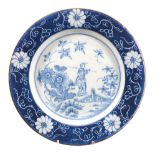 A London delft powdered-blue bordered blue and white chinoiserie plate,   mid 18th century,