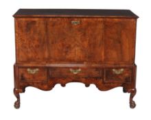 A burr walnut chest on stand  , circa 1735 and later, the hinged top with moulded edge opening to