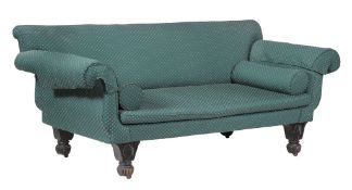 A Regency ebonised and upholstered sofa,   circa 1815, the rectangular back flanked by