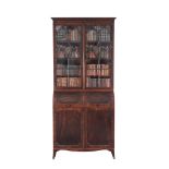 A George III mahogany bureau bookcase  , circa 1790, the moulded cornice above a pair of astragal