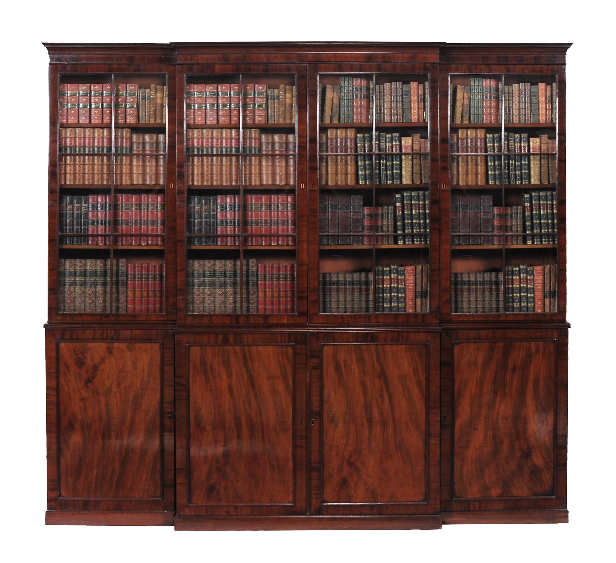 A Regency mahogany breakfront library bookcase,   circa 1815, the moulded cornice above four