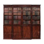 A Regency mahogany breakfront library bookcase,   circa 1815, the moulded cornice above four