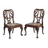 A pair of George II walnut chairs, circa 1735, attributed to Giles Grendey,   each cartouche shaped