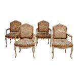 A set of four French cream painted and parcel gilt armchairs in Louis XV style  , early 20th