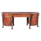 A George III mahogany breakfront sideboard,   circa 1800,  in the manner of Thomas Hope, the