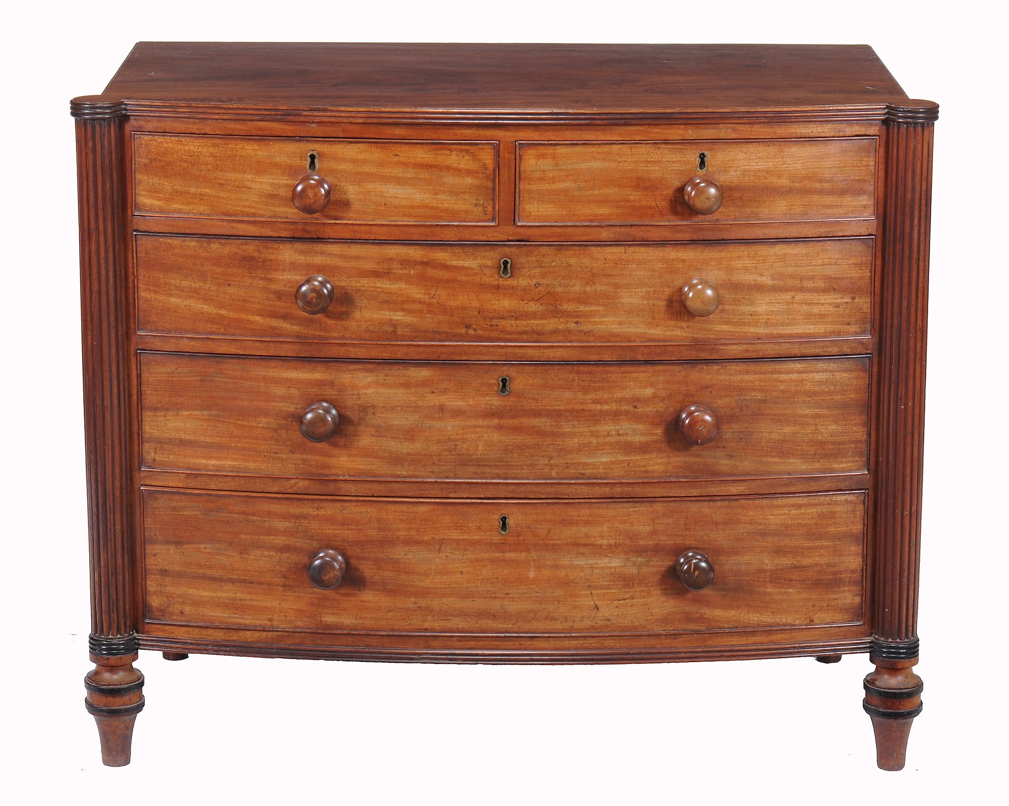 A Regency mahogany bowfront chest of drawers,   circa 1815, the top with reeded edge, above two