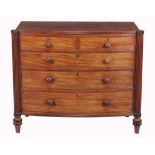 A Regency mahogany bowfront chest of drawers,   circa 1815, the top with reeded edge, above two
