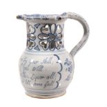 A Liverpool delft blue and white puzzle jug  , circa 1760, typically decorated with a panel of