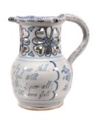 A Liverpool delft blue and white puzzle jug  , circa 1760, typically decorated with a panel of