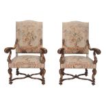 A pair of carved beech and tapestry upholstered armchairs in 17th century style  , late 19th/ early