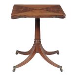 A George III mahogany folding envelope card table,   circa 1790, the top incorporating four hinged