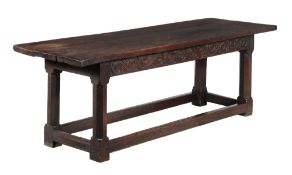 An oak refectory table,   circa 1650 and later,  the triple plank rectangular top above frieze with