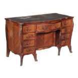 A George III mahogany, rosewood and goncalo alves serpentine desk, circa 1770, the tooled leather