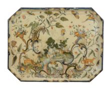 A Rouen faience shaped rectangular tray,   mid 18th century, decorated in the Rococo manner with an