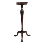 A George II mahogany torchere stand  , circa 1850, the flared beaded circular top with galleried