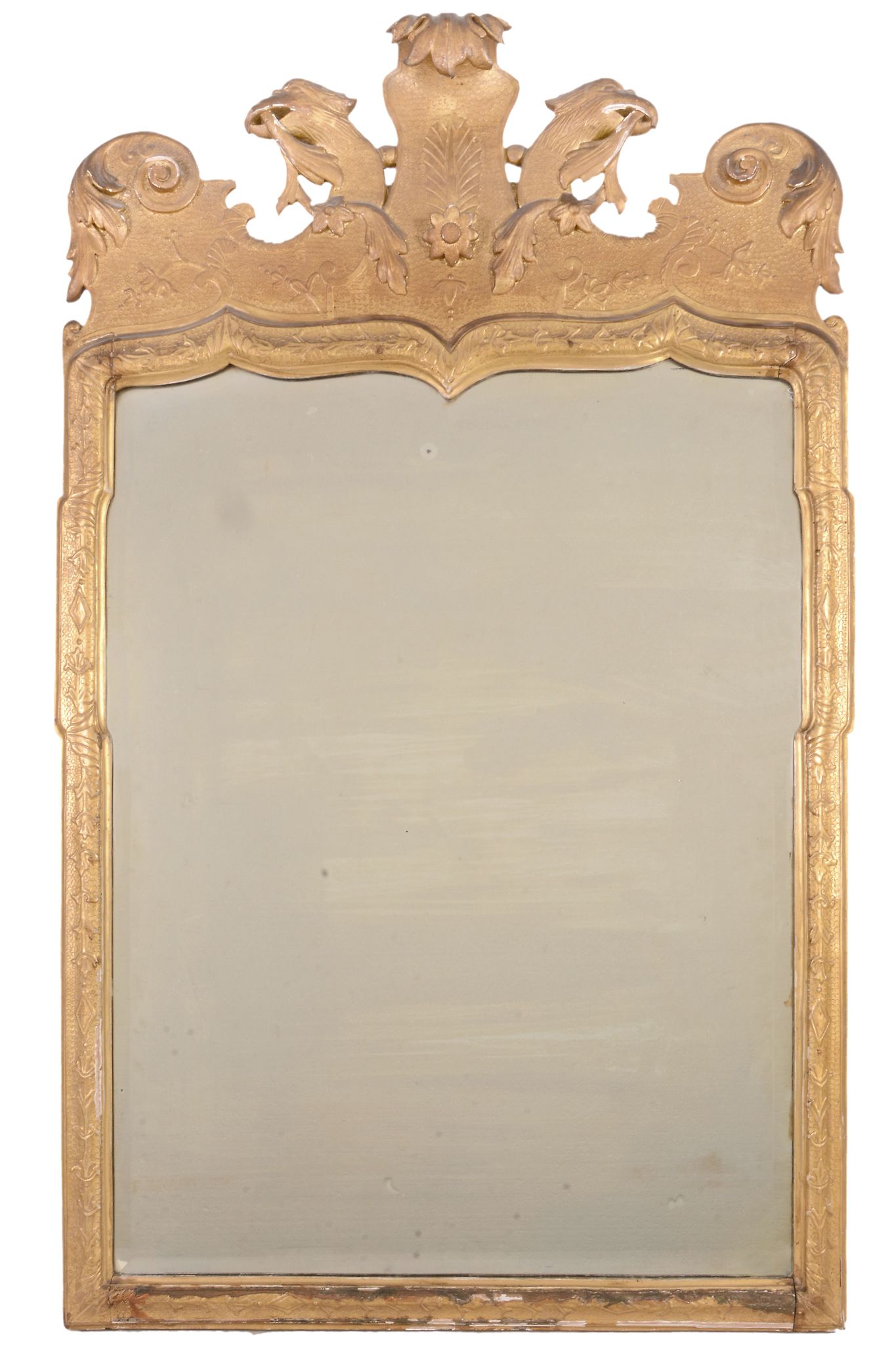 A George I giltwood and gesso wall mirror  , circa 1720, the shaped bevelled plate within a