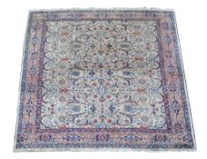 A Tabriz carpet, of overall design, the ivory field decorated with scrolling foliage and boteh,