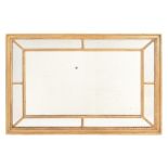 A George III giltwood and composition wall mirror,   circa 1790, the central rectangular plate and