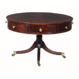 A George III mahogany drum library table,   circa 1790, the crossbanded top with radiating plum