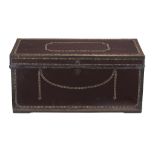 A leather and brass bound camphorwood trunk  , first quarter 19th century, with all over decorative