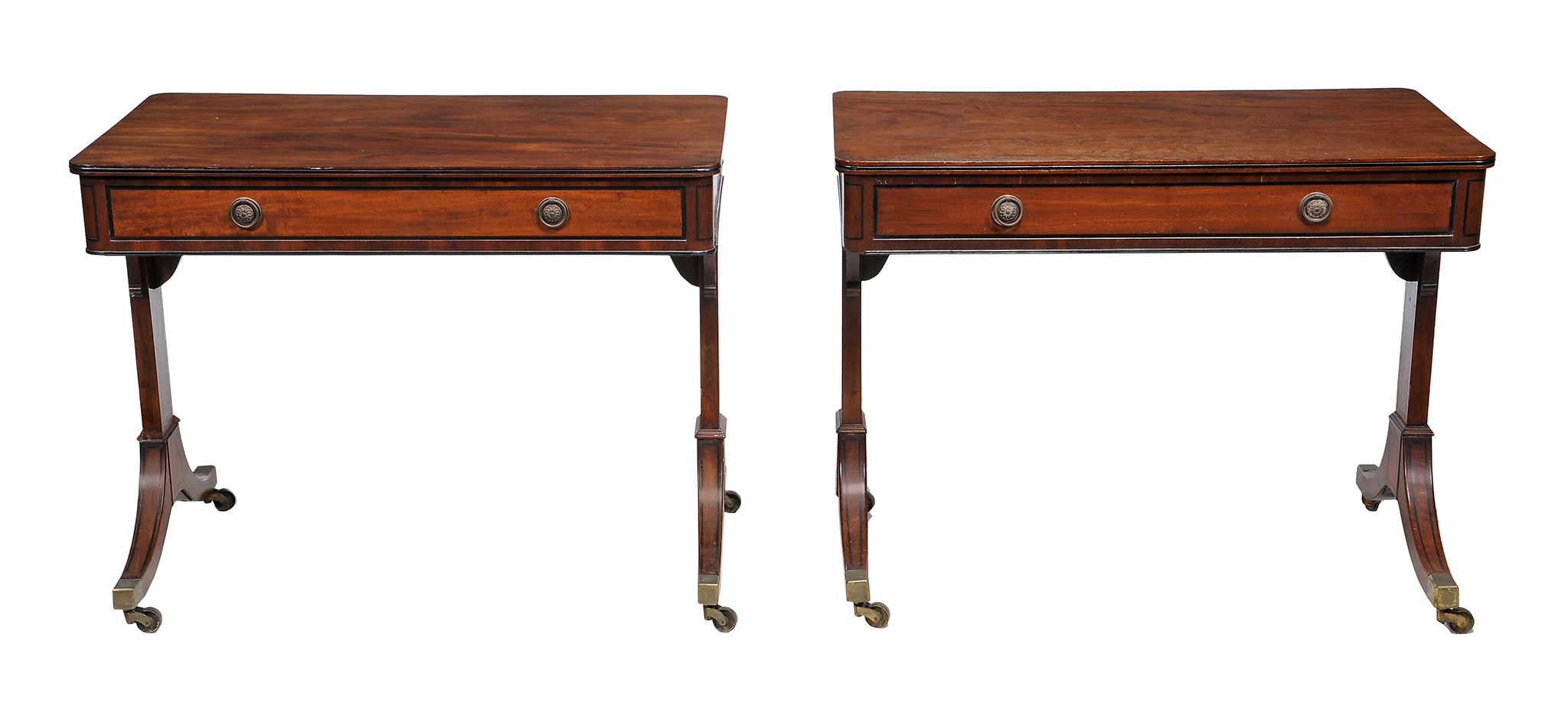 A matched pair of Regency mahogany and ebony strung library tables  , circa 1815, in the manner of