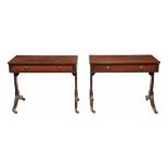 A matched pair of Regency mahogany and ebony strung library tables  , circa 1815, in the manner of