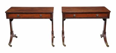 A matched pair of Regency mahogany and ebony strung library tables  , circa 1815, in the manner of