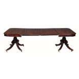 A George IV mahogany extending dining table,   circa 1825, with two additional leaf insertions, the