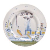 A Bristol delft polychrome chinoiserie dish  ,  circa 1760 , decorated with a crane in a stylized