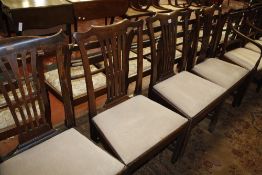A pair of George III mahogany dining chairs and two further similar examples