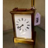 A French carriage clock by R.C., striking on gongs, the white enamel dial bearing the name of ‘