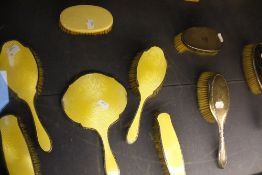 A silver and yellow enamel dressing table set, Birmingham (5) (af), a silver and tortoiseshell