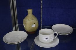 Dame Lucie Rie D.B.E (1902-1995), a tea cup and five saucers, off white glazed, each marked, the