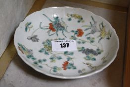 A Chinese famille verte saucer, blue marks to base, 13.5cm
