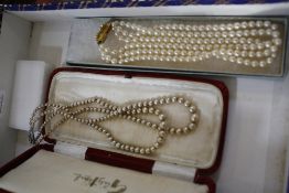 Three pearl necklaces with boxes and an ivory and silver coloured metal mounted necklace (4)