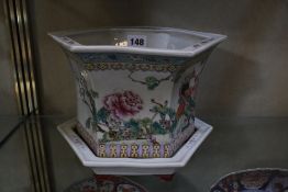 A Chinese famille rose jardinière and stand, hexagonal shaped, 17cm high, a Japanese blue and
