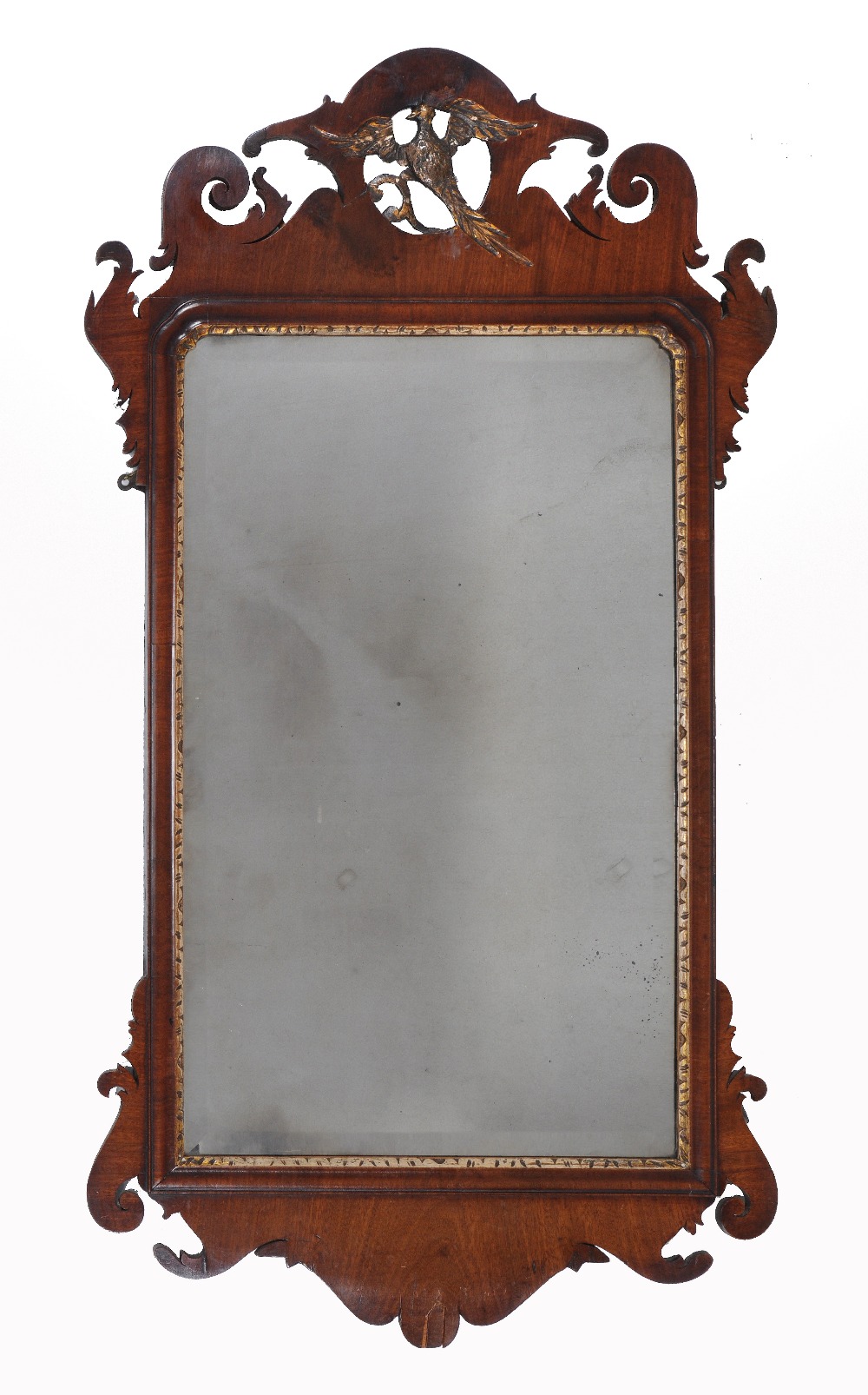 A George III walnut fretwork wall mirror, circa 1780, the fret cut frame surmounted by pierced ho-ho