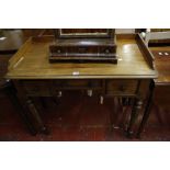 A 19th Century mahogany kneehole table with a three quarter gallery, three frieze drawers on