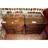 A pair of Orient hardwood bedside cupboards 56cm wide