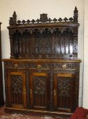 A 19th Century oak Gothic design sideboard profusely carved bearing inscription HOPE HELPE TH