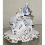 A Continental 20th Century porcelain group of a man and a woman (af), 11cm high