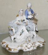 A Continental 20th Century porcelain group of a man and a woman (af), 11cm high